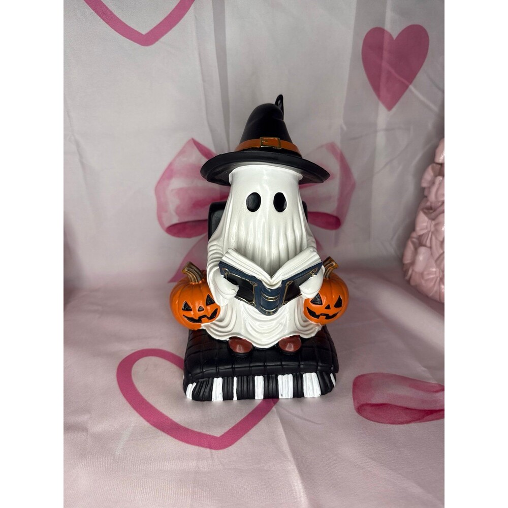 Halloween ghost reading a book